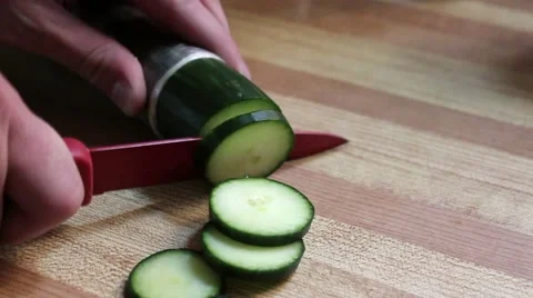 Man Cutting A Cucumber Stock Footage 64972909