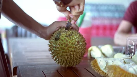 Man cutting durian Stock Footage 131096790
