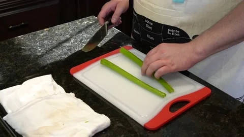 Man Cutting Food In A Kitchen Stock Footage 137267798