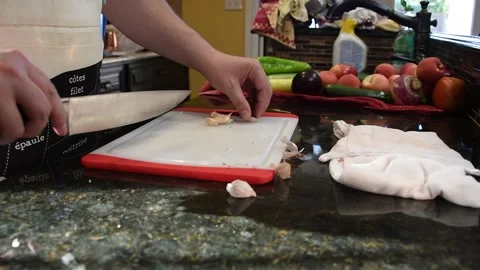 Man Cutting Food In A Kitchen Stock Footage 137268316