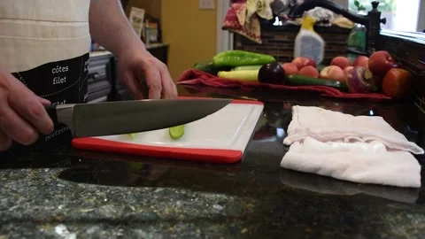 Man Cutting Food In A Kitchen Stock Footage 137268338