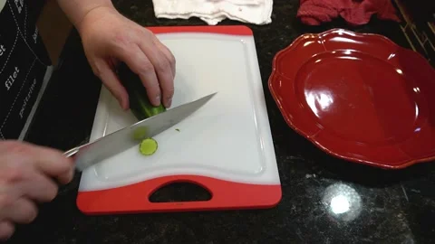 Man Cutting Food In A Kitchen Stock Footage 137268490
