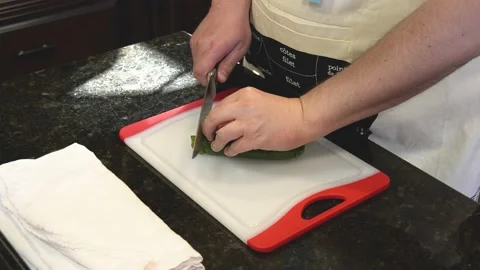 Man Cutting Food In A Kitchen Video stock 137269394