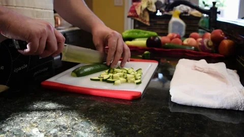 Man Cutting Food In A Kitchen Stock Footage 137269711