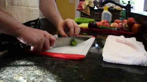 Man Cutting Food In A Kitchen Stock Footage 137269760