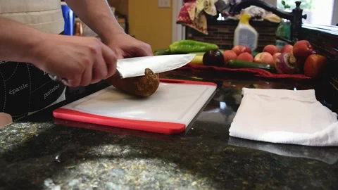 Man Cutting Food In A Kitchen Stock Footage 137269889