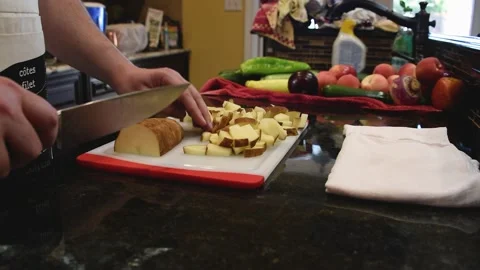 Man Cutting Food In A Kitchen Stock Footage 137269902