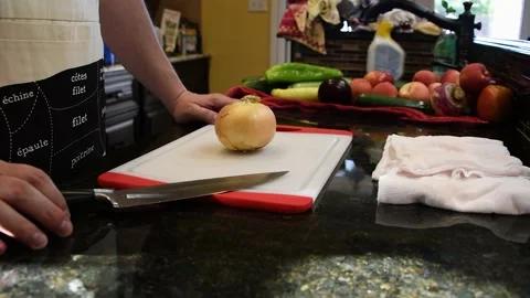 Man Cutting Food In A Kitchen Stock Footage 137269945