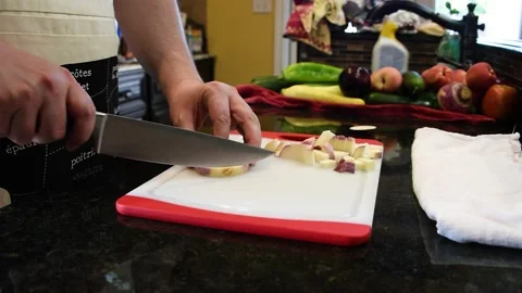 Man Cutting Food In A Kitchen Stock Footage 137270197