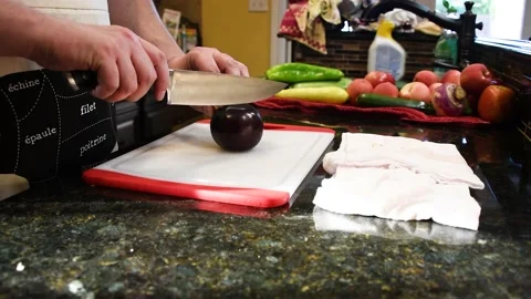 Man Cutting Food In A Kitchen Stock Footage 137270217