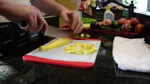Man Cutting Food In A Kitchen Video stock 137270342