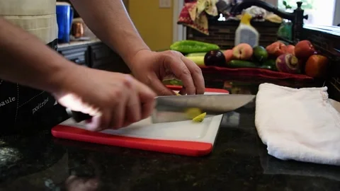 Man Cutting Food In A Kitchen Video stock 137270357