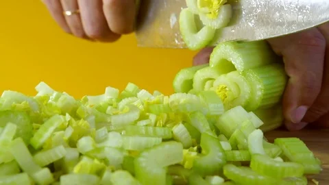 Man cutting fresh celery Stock Footage