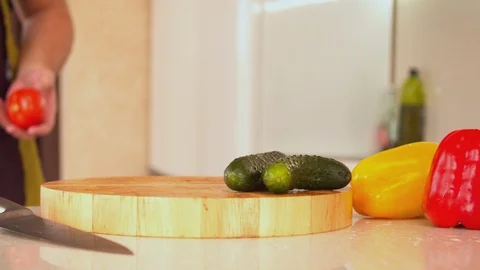 Man cutting fresh red tomatoes Stock Footage 130056985
