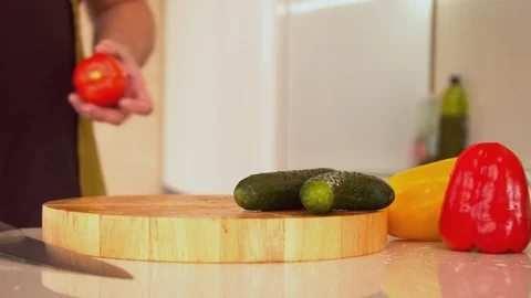 Man cutting fresh red tomatoes Stock Footage 130057135