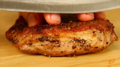 Man cutting  fried  pork on board, indoor Chiangmai Thailand Stock Footage 124899564