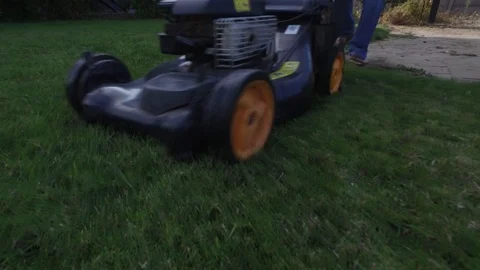 Man cutting green grass Stock Footage 120906723