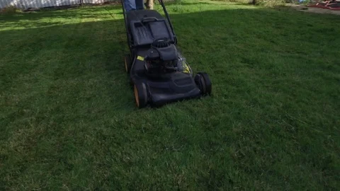 Man cutting green grass Stock Footage 120906857