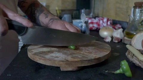 Man cutting a green pepper into thin slices. Stock Footage 129865453