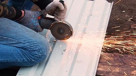 Man cutting grinding machine, angle grinder metal sheet. Stock Footage 108712958