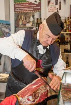 Man cutting a ham Stock Photos