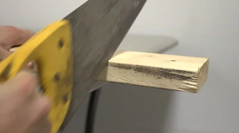 Man cutting with Handsaw Stock Footage 58844155