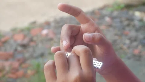 A man is cutting his fingernails using a metal nail clipper Stock Footage 333343100
