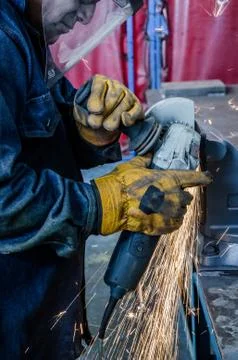 Man cutting iron Stock Photos