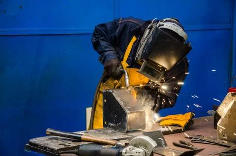 Man cutting iron Stock Photos