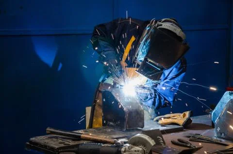 Man cutting iron Stock Photos