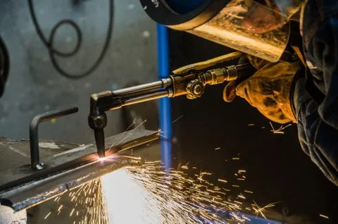 Man cutting iron Stock Photos