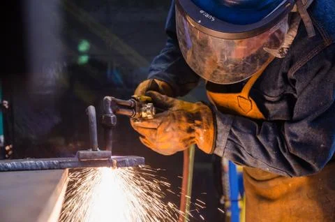 Man cutting iron Stock Photos