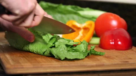Man cutting lettuce close up Stock Footage 61394467