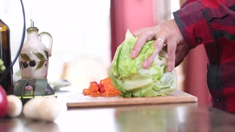 Man cutting a lettuce Stock Footage 70336794