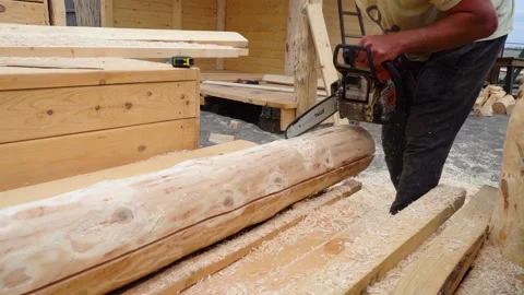 Man Cutting Lumber With Chainsaw Outside 库存影片 158106781