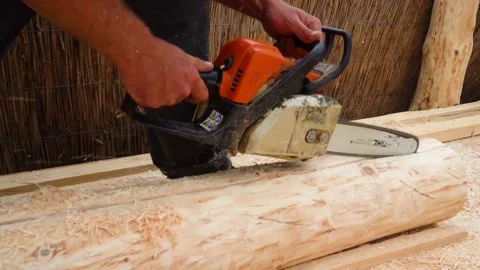 Man Cutting Lumber With Chainsaw Outside 库存影片 158109064