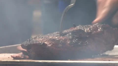 Man Cutting Meat Stock Footage