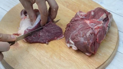 Man cutting meat Stock Footage 82530615