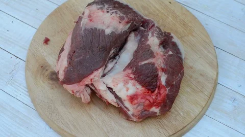 Man cutting meat Stock Footage 82530617