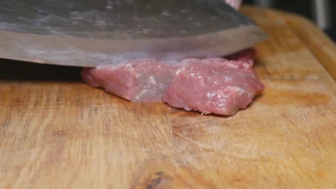 A man is cutting meat. Stock Footage 83527399