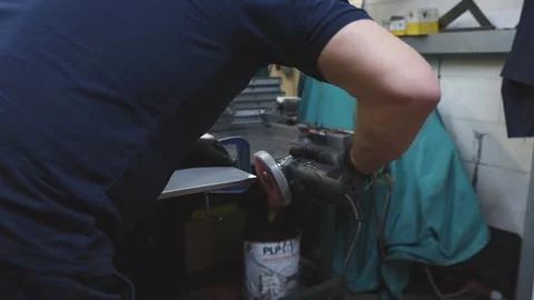 A man is cutting metal with a grinder Video stock 302457164