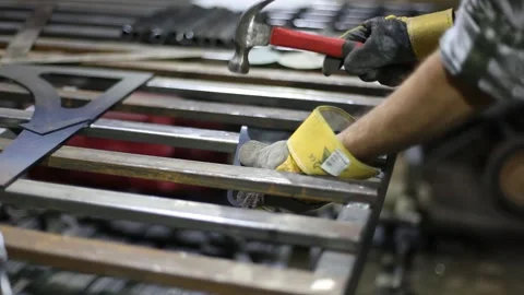 Man cutting metal using grinding machine in hangar Stock Footage 139586451