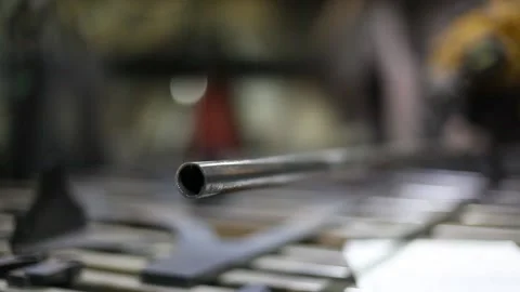 Man cutting metal using grinding machine in hangar Stock Footage 139587745