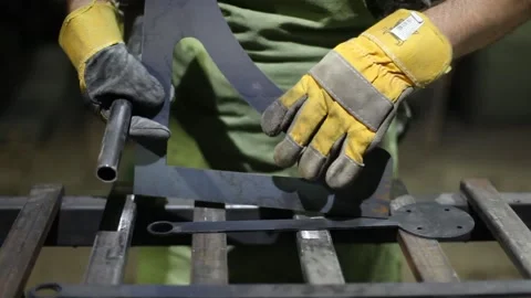 Man cutting metal using grinding machine in hangar Stock Footage 139588471