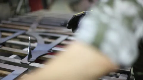 Man cutting metal using grinding machine in hangar Stock Footage 139590967
