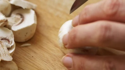 Man cutting mushrooms Stock Footage 70281948