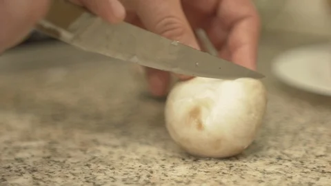 A man is cutting mushrooms on the kitchen 스톡 동영상 87267787