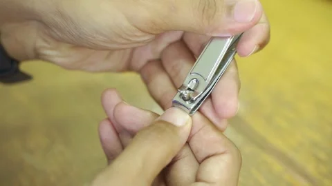 Man cutting nails using nail clipper Video stock 322116095