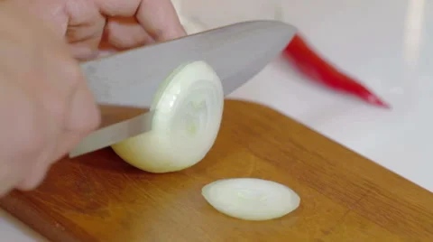 Man cutting up an onion with a knife Stock Footage 59758821