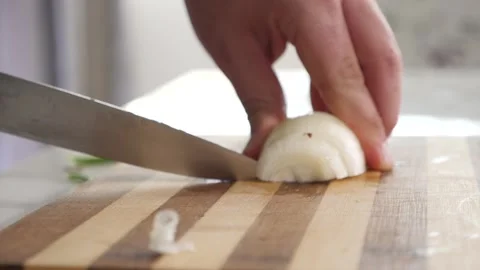 Man cutting an onion with a knife 스톡 동영상 137211363